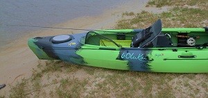 Rear of kayak shown:  Fly rod positioned rearward, using front bungy position within hull just forward of seat.